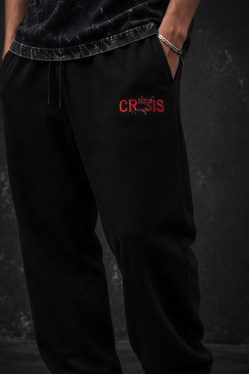 A man modeling a black acid-wash t-shirt and black sweatpants with red 'TREESBYR' logos, set against a dark textured background with product feature callouts.
