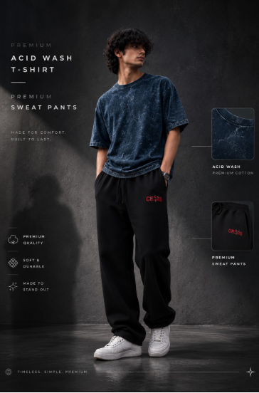 A man modeling an acid-wash blue t-shirt and black sweatpants with a red logo, set against a dark textured studio background with product feature callouts.